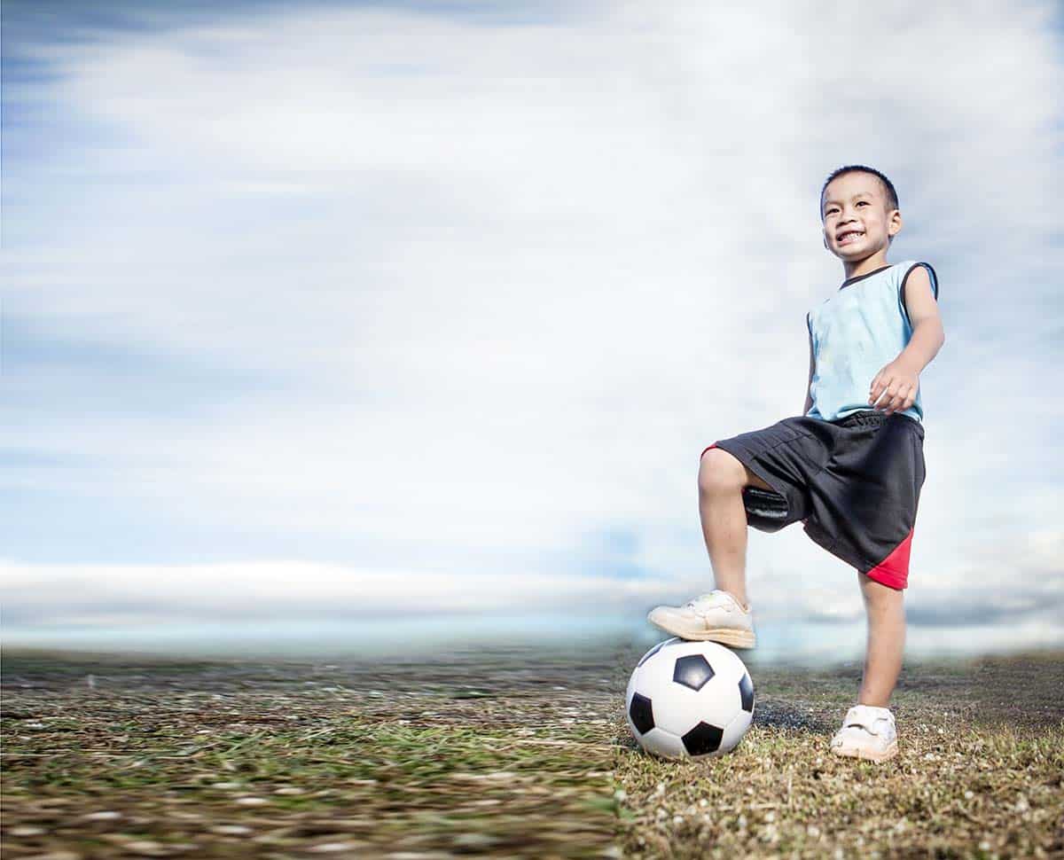 Child Soccer Player On Soccer Field