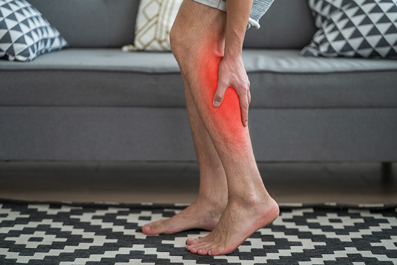 The Man's Calf Muscle Cramped, Massage Of Male Leg At Home